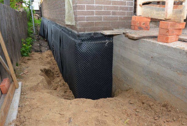 Happy homeowners after waterproofing job in Hilton